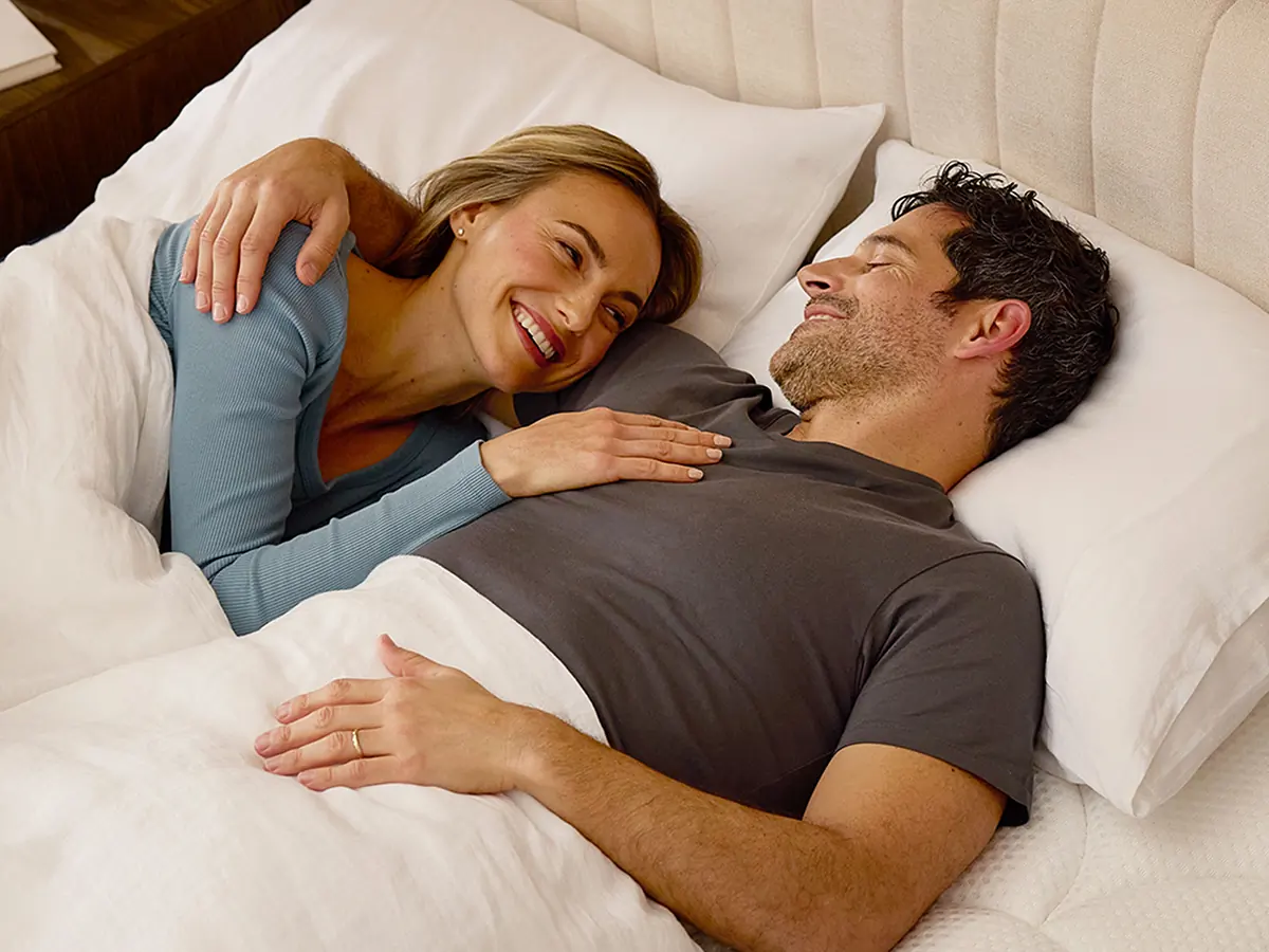 Couple sleeping peacefully on Dreamcloud Hybrid Mattress