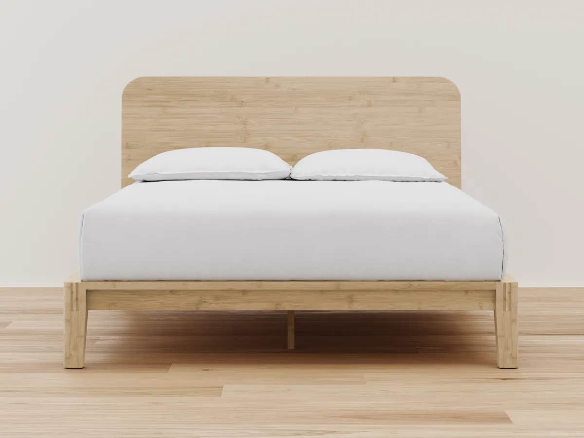 Bed with white sheets and two pillows